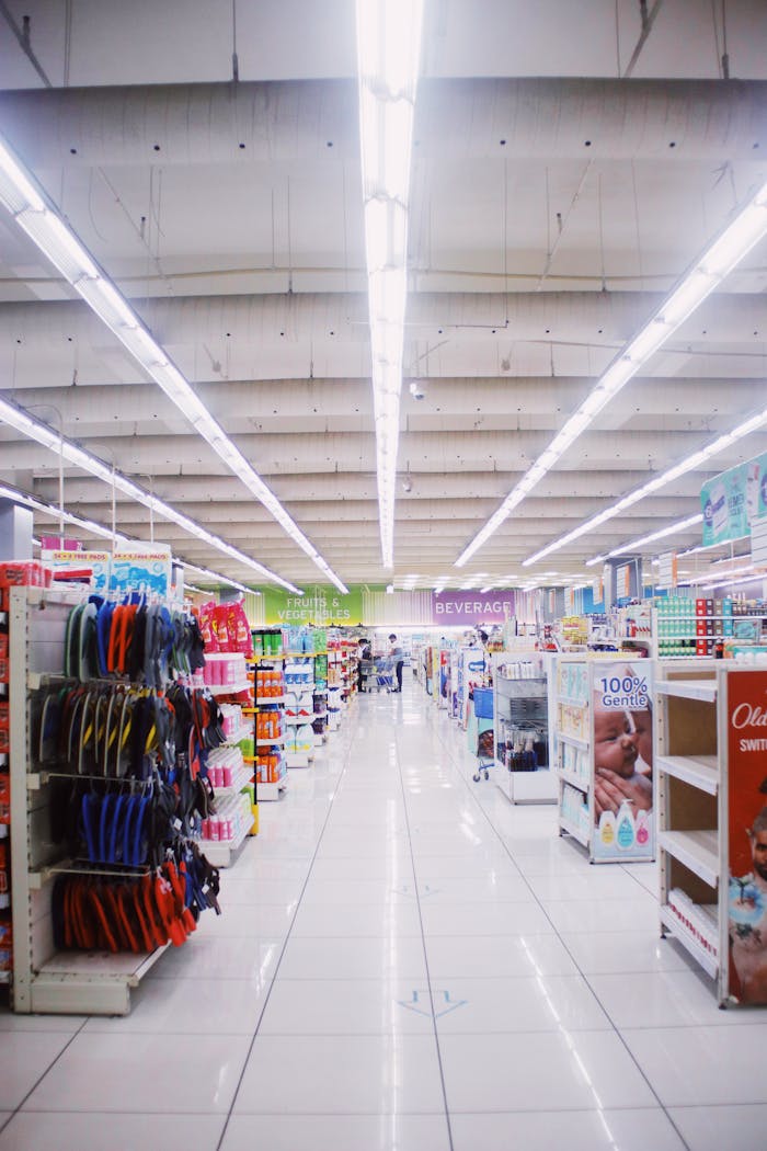 services-02 Interior of light spacious hallway among shelves with assorted products in contemporary supermarket
