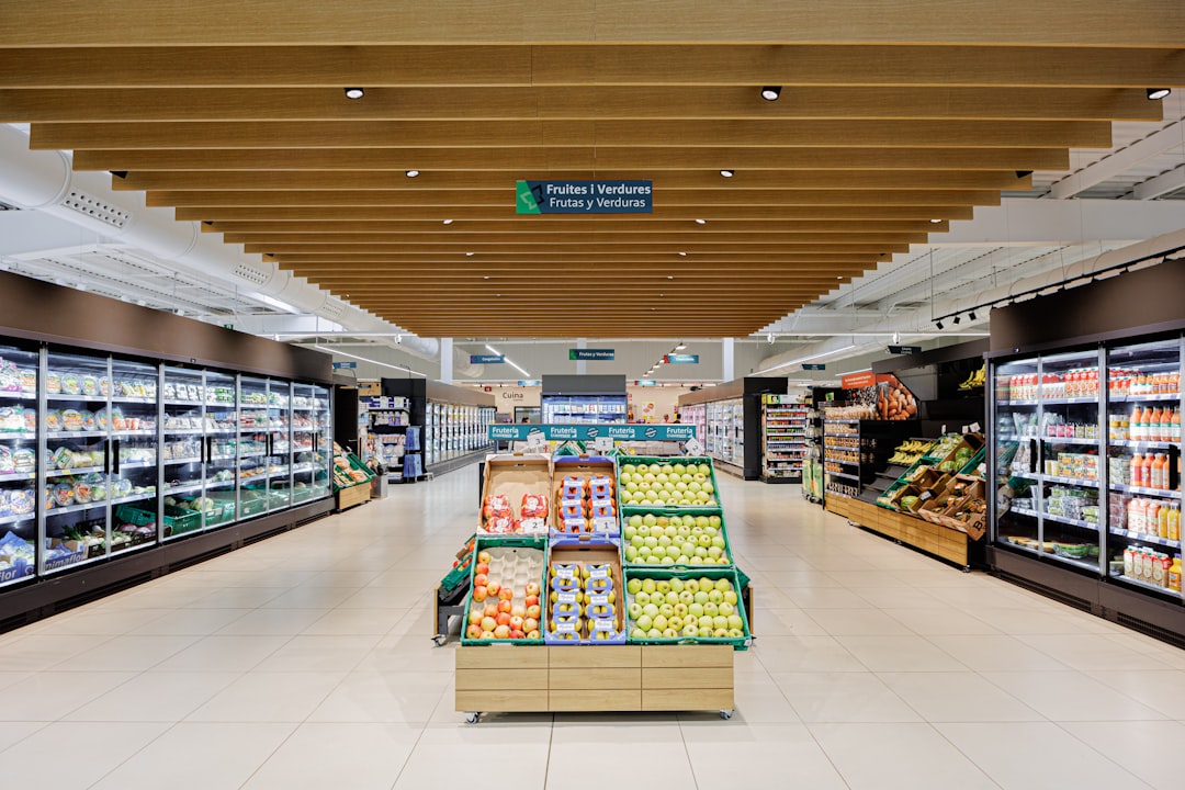 about-02 a-well-lit-grocery-store-aisle-with-produce-displays-2vgvrwpwkye